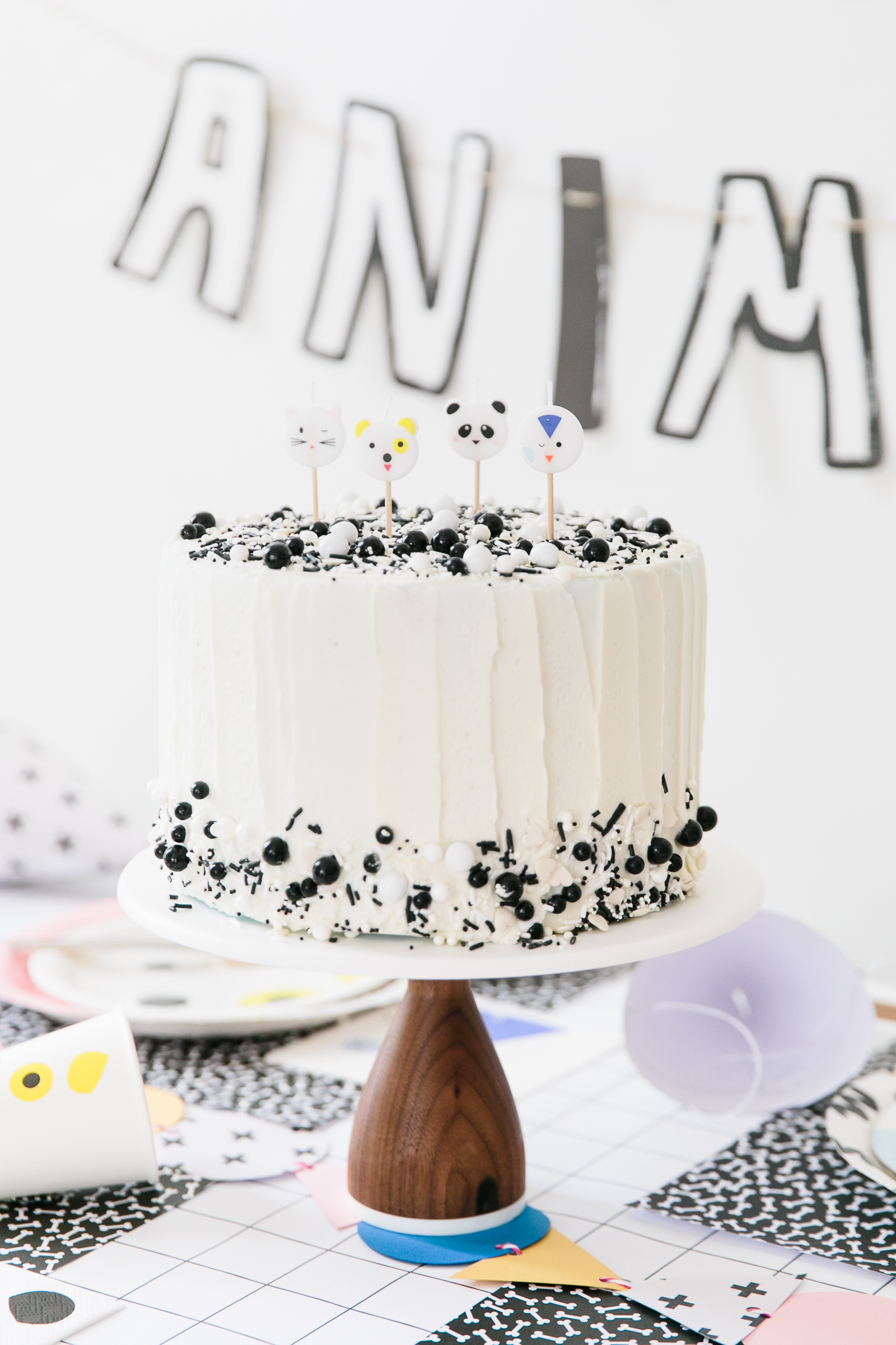 Modern Black and White Sprinkle Cake with Animal Candles 