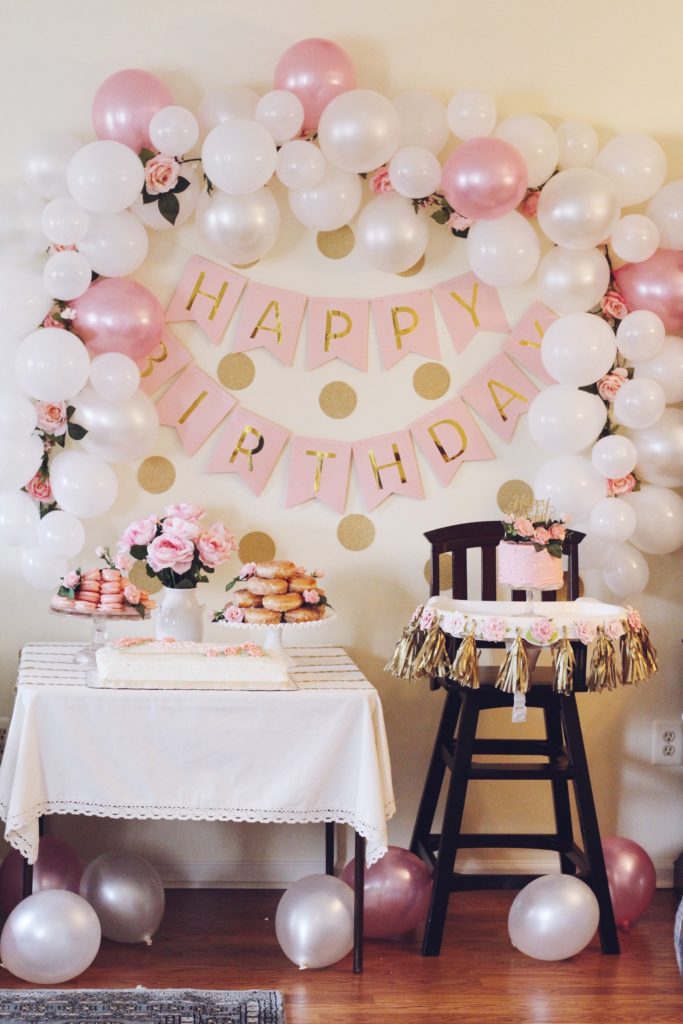 diy party pink floral gold polka dot first birthday party macarons donuts smash cake birthday cake balloon arch