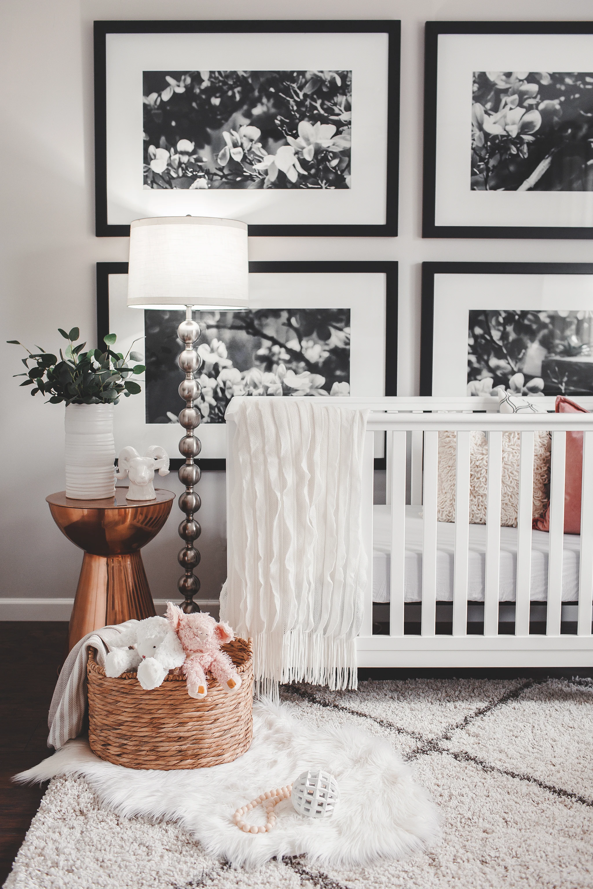 Large Black and White Floral Photos Behind Crib - Project Nursery