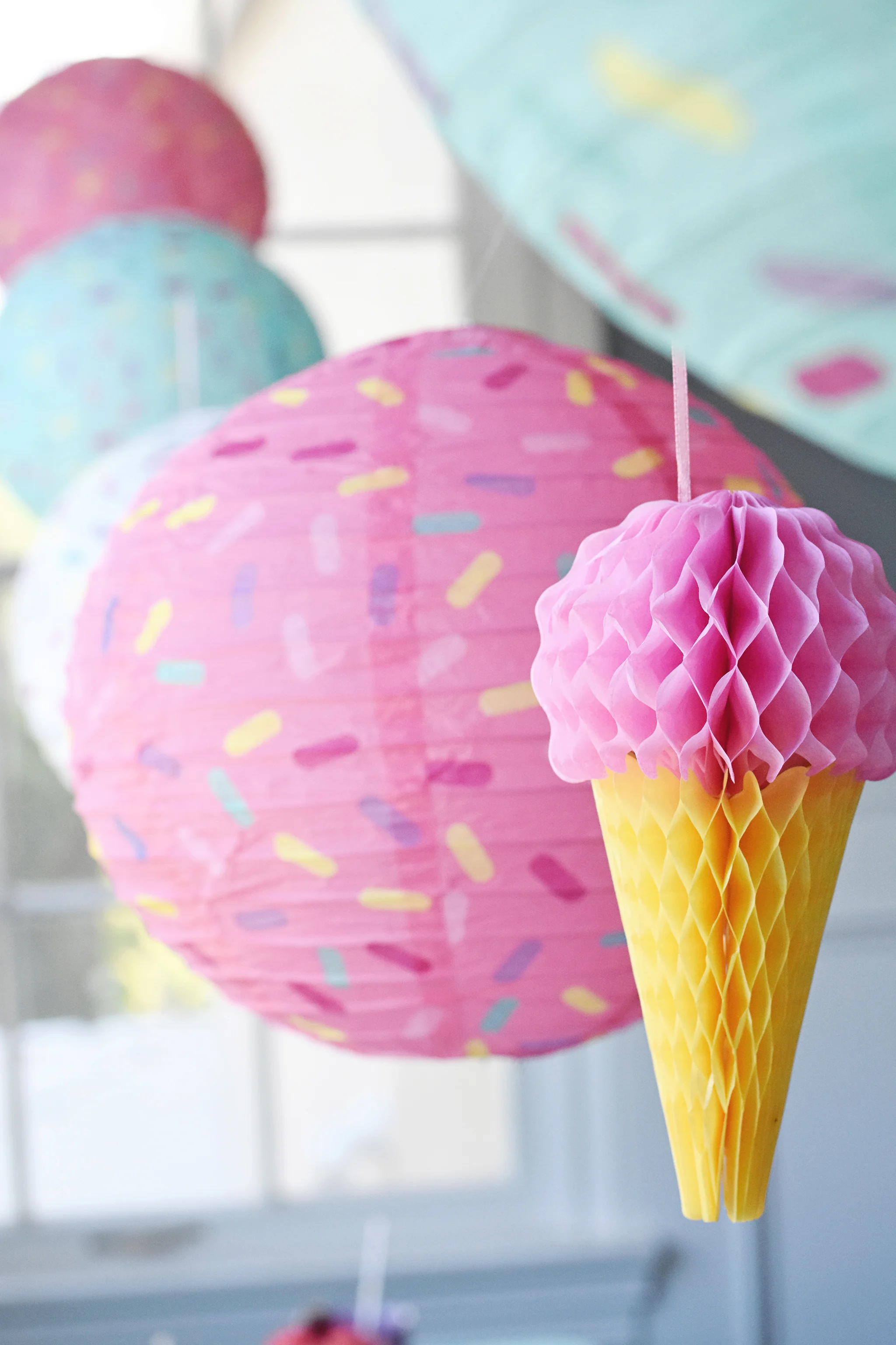 Sprinkle lanterns and honeycomb ice cream cone decorations
