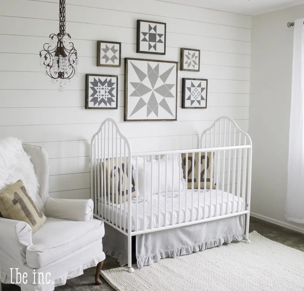 White Gender Neutral Nursery with Shiplap Wall and Quilt Inspired Artwork - Project Nursery