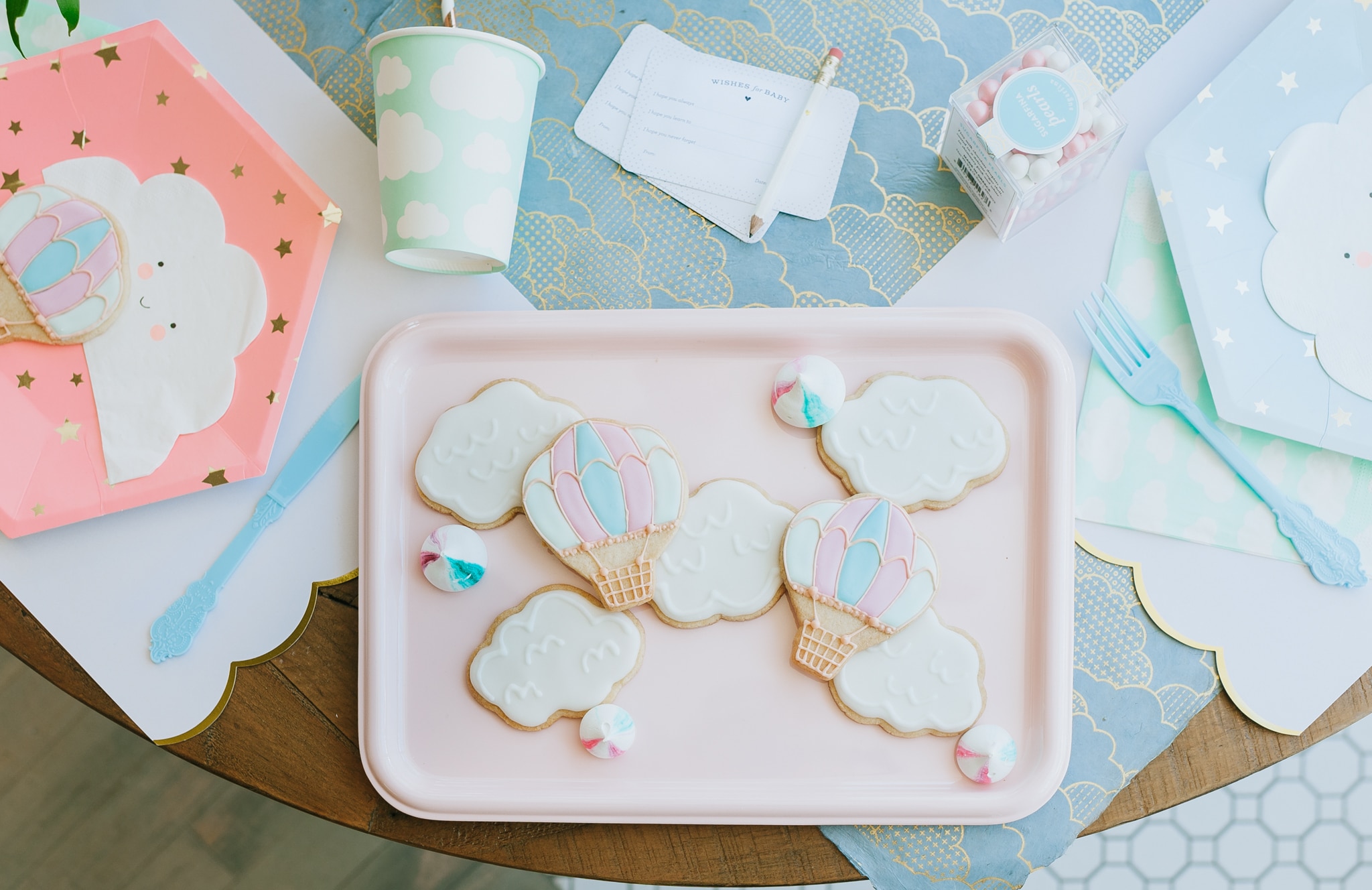Hot air balloon and cloud baby shower cookies on pink tray - Project Nursery