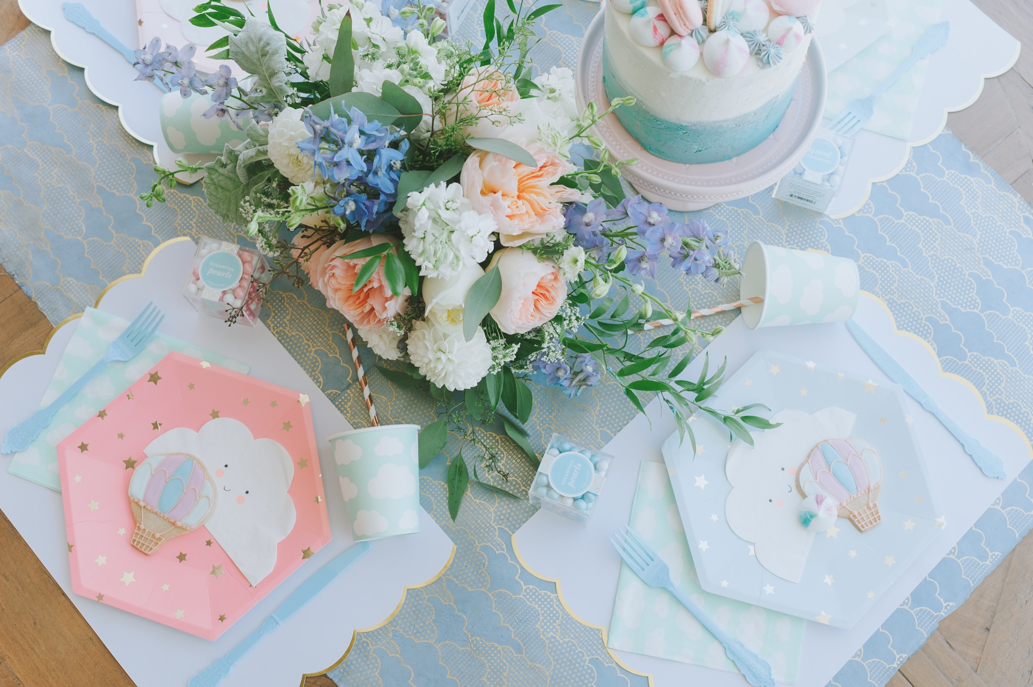 Overhead hot air balloon baby shower place setting and flowers - Project Nursery