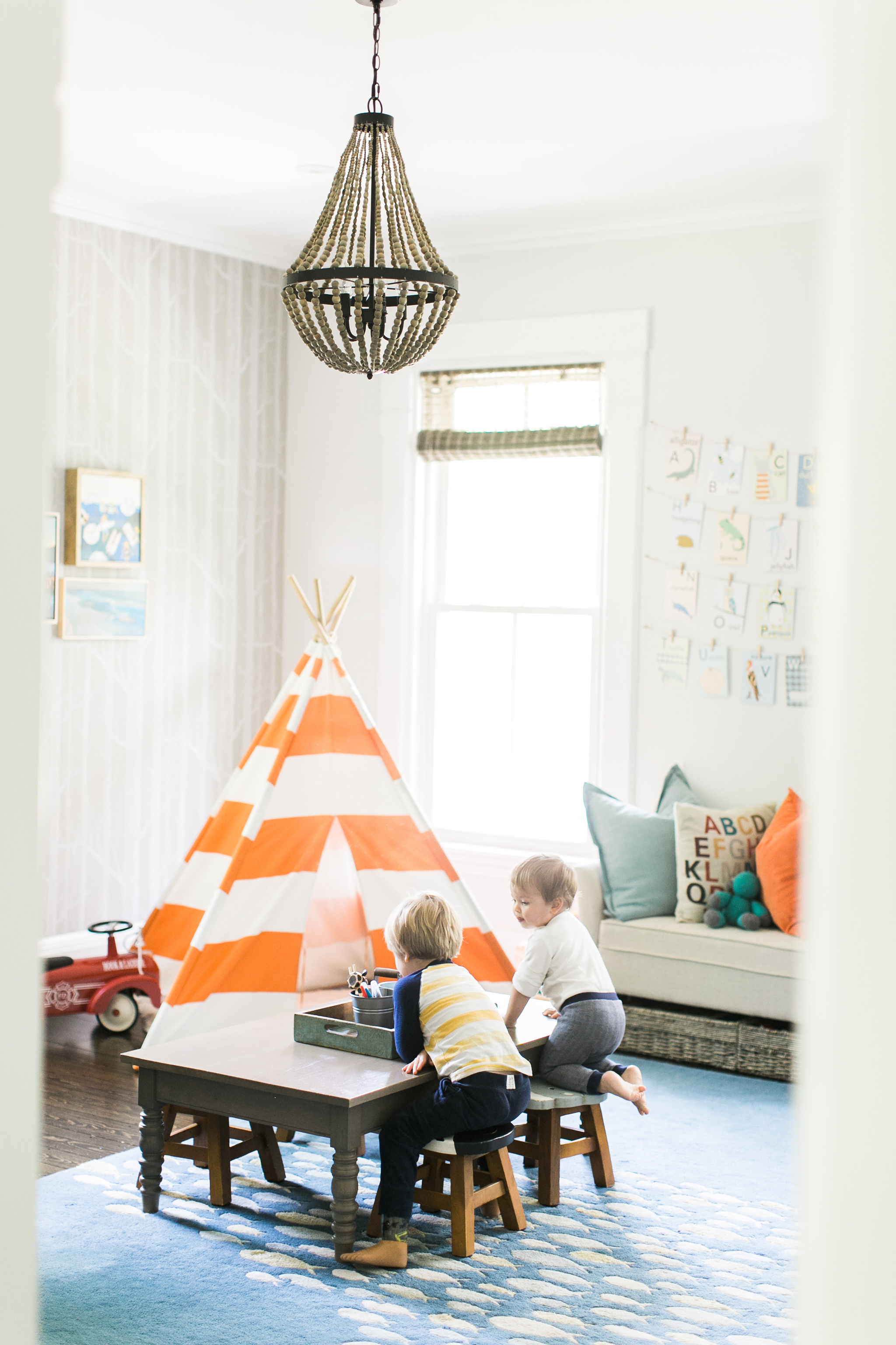 Colorful Playroom with Fish Rug and Orange Teepee - Project Nursery