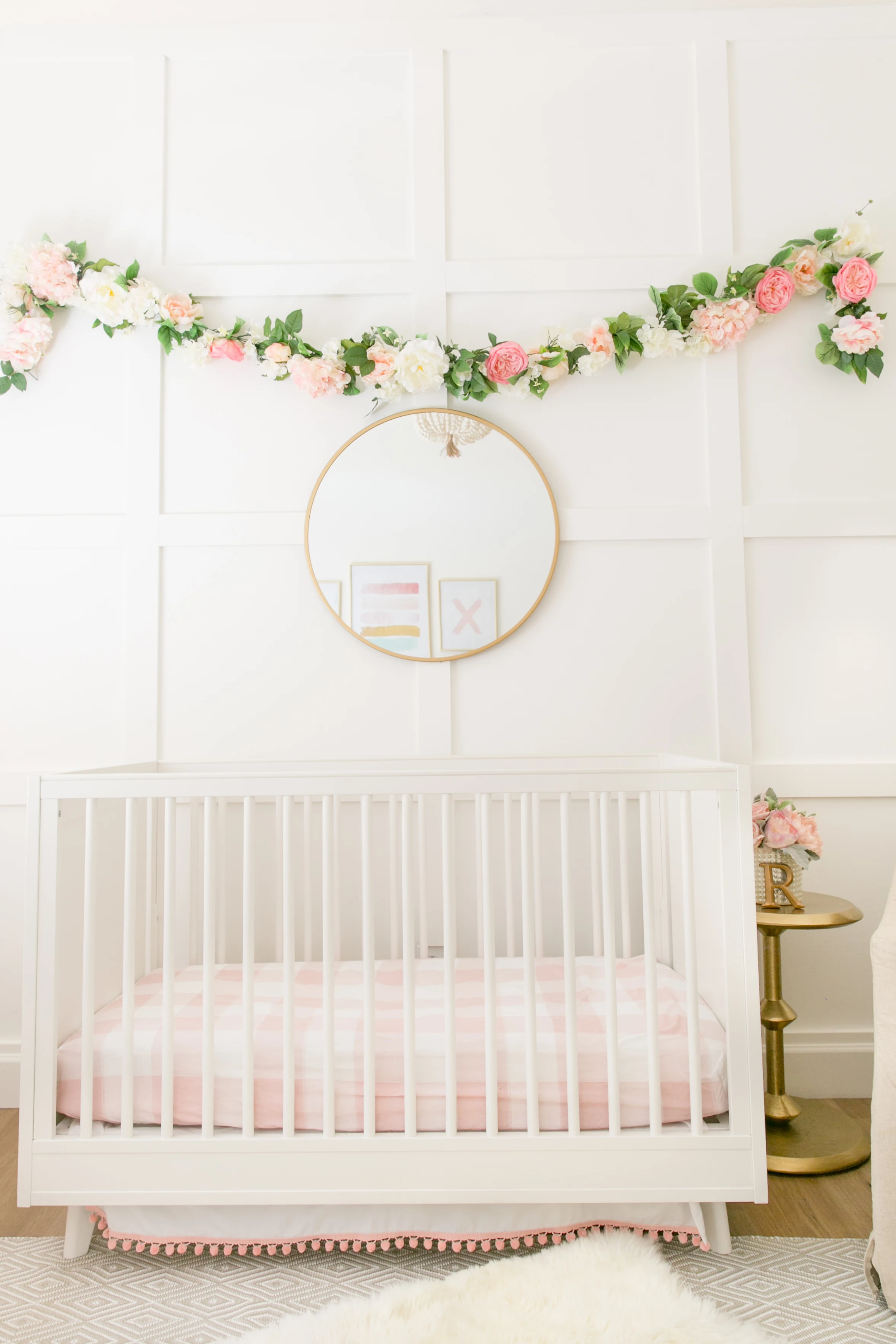 Square Molding Accent Wall with Floral Garland in Nursery