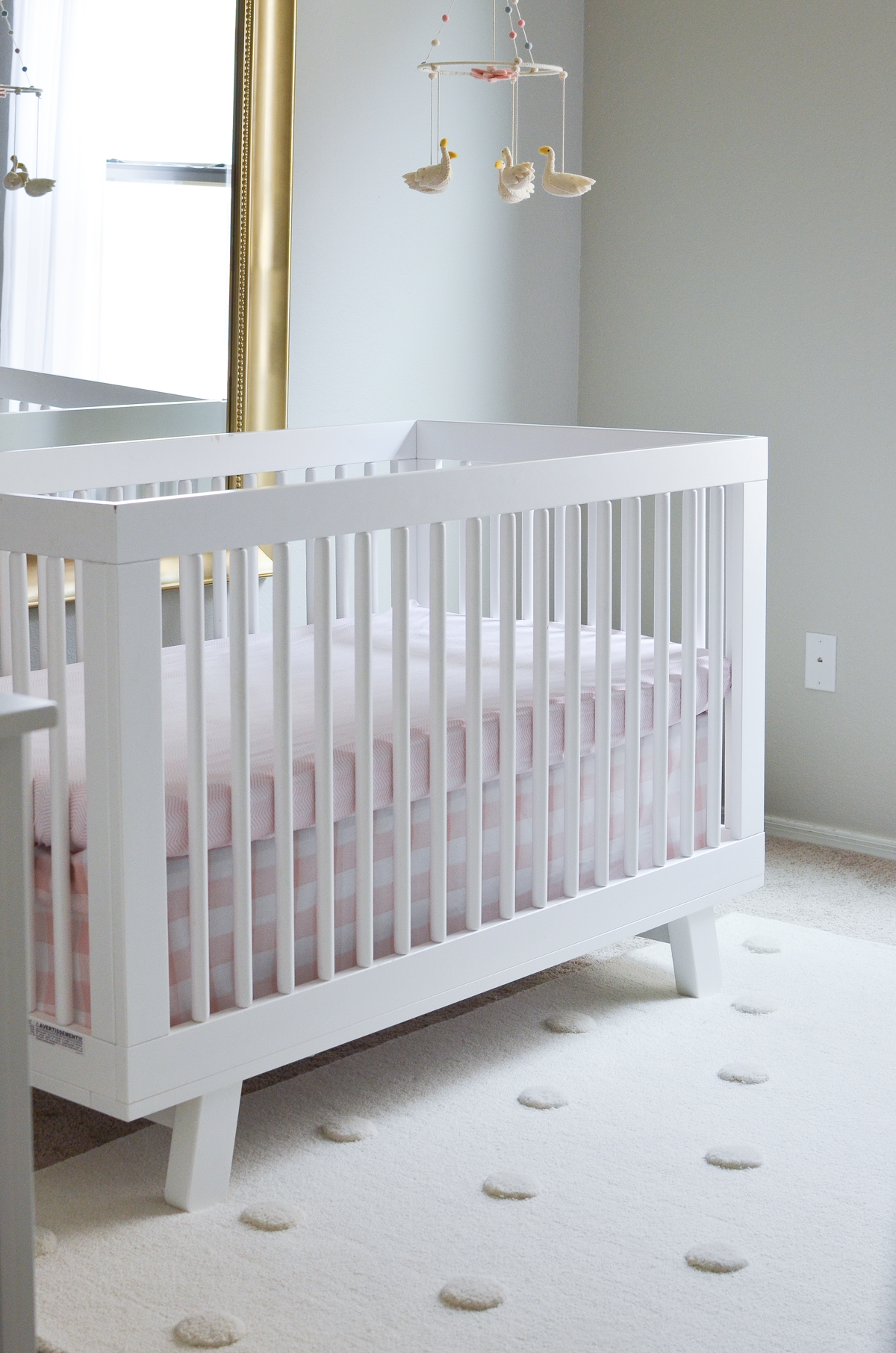 Babyletto White Crib and Pehr Rug in Swan Inspired Nursery