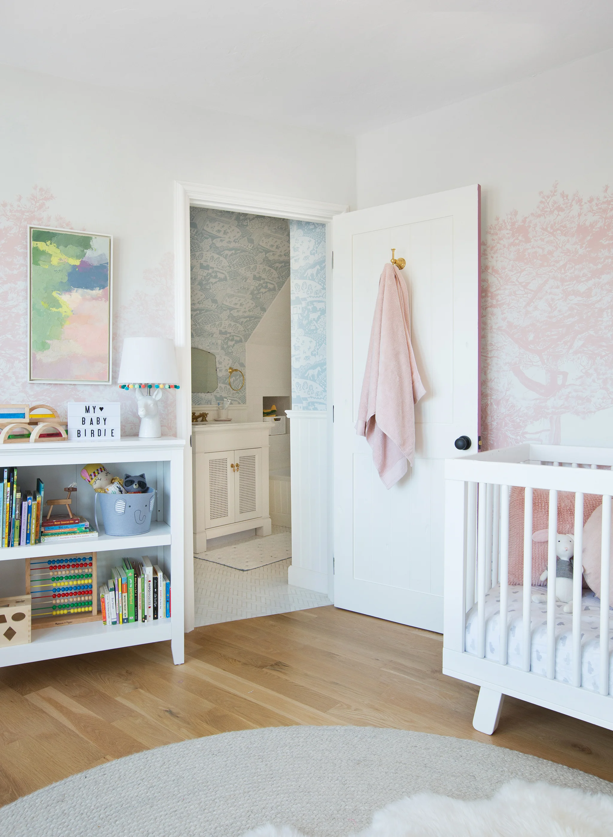 Emily Henderson Girl Nursery with Pink Tree Wallpaper