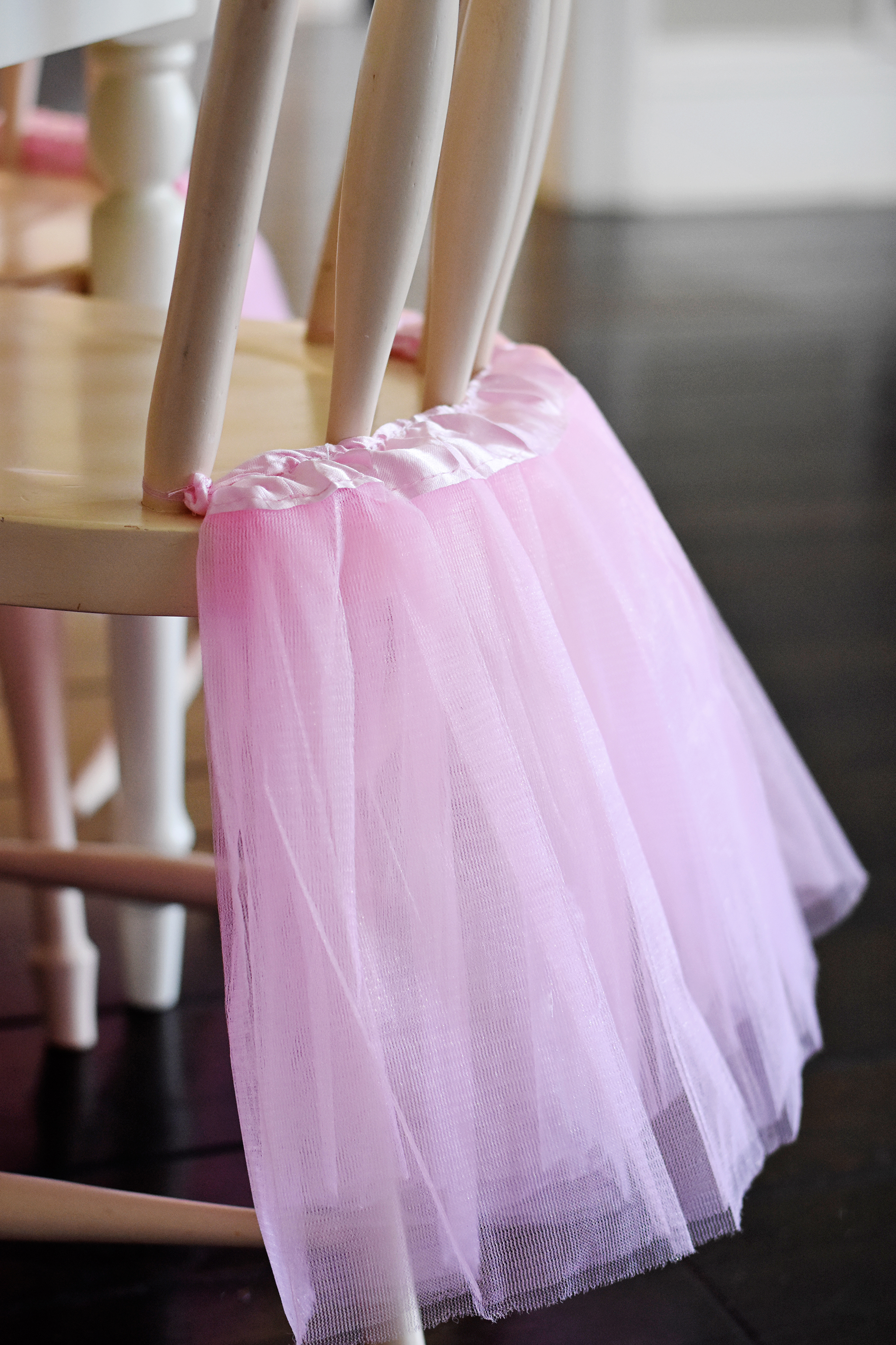 Dress up plain chairs with inexpensive pink tutu skirts!