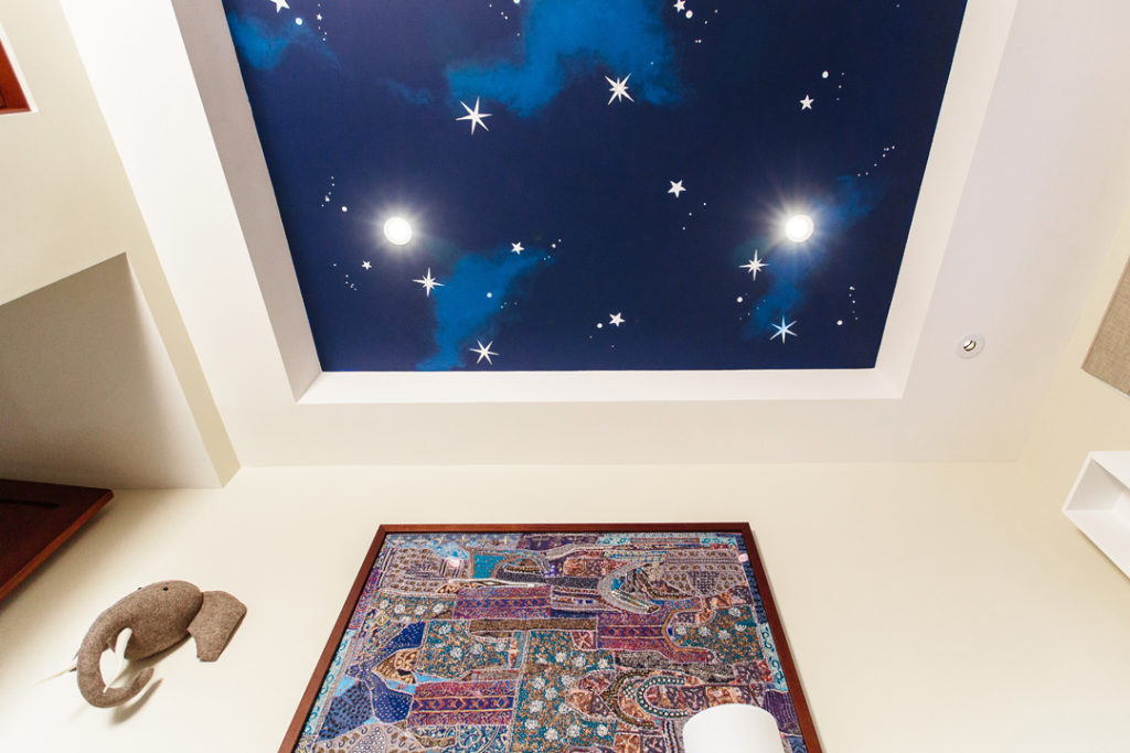 Nursery with Night Sky Mural by Little Crown Interiors