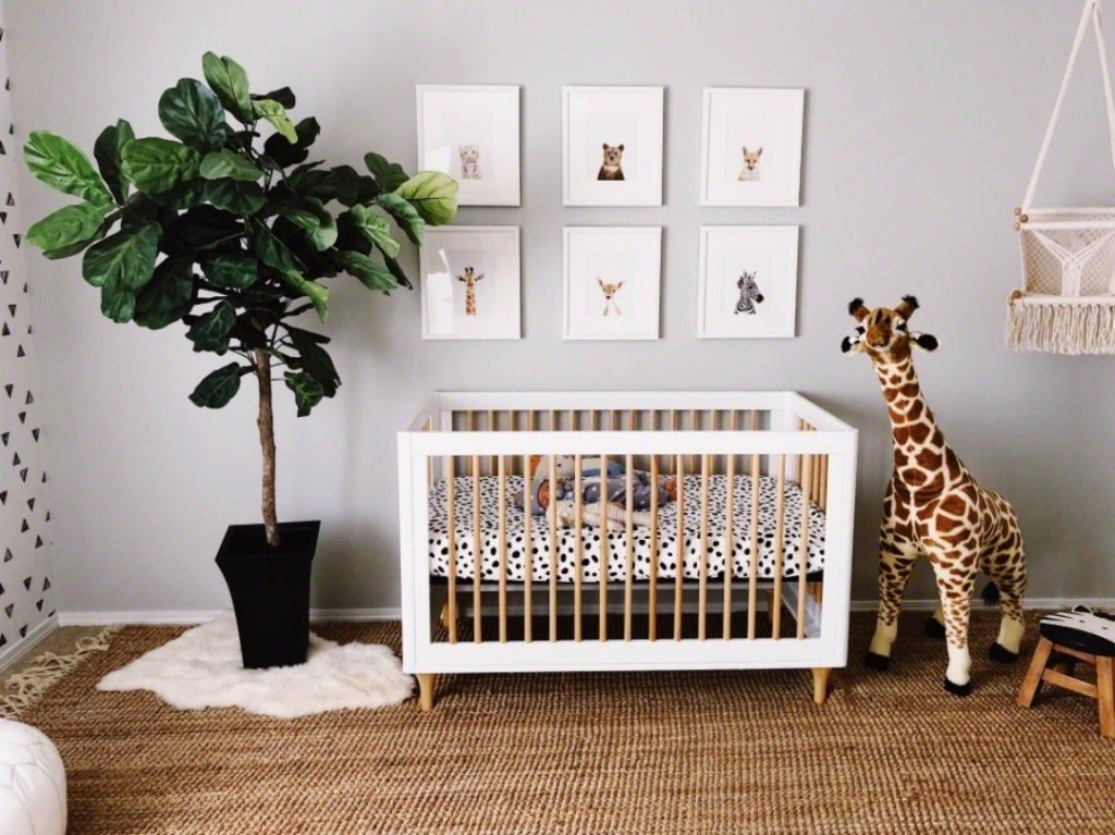 Animal Prints above Crib in Neutral Boho Nursery