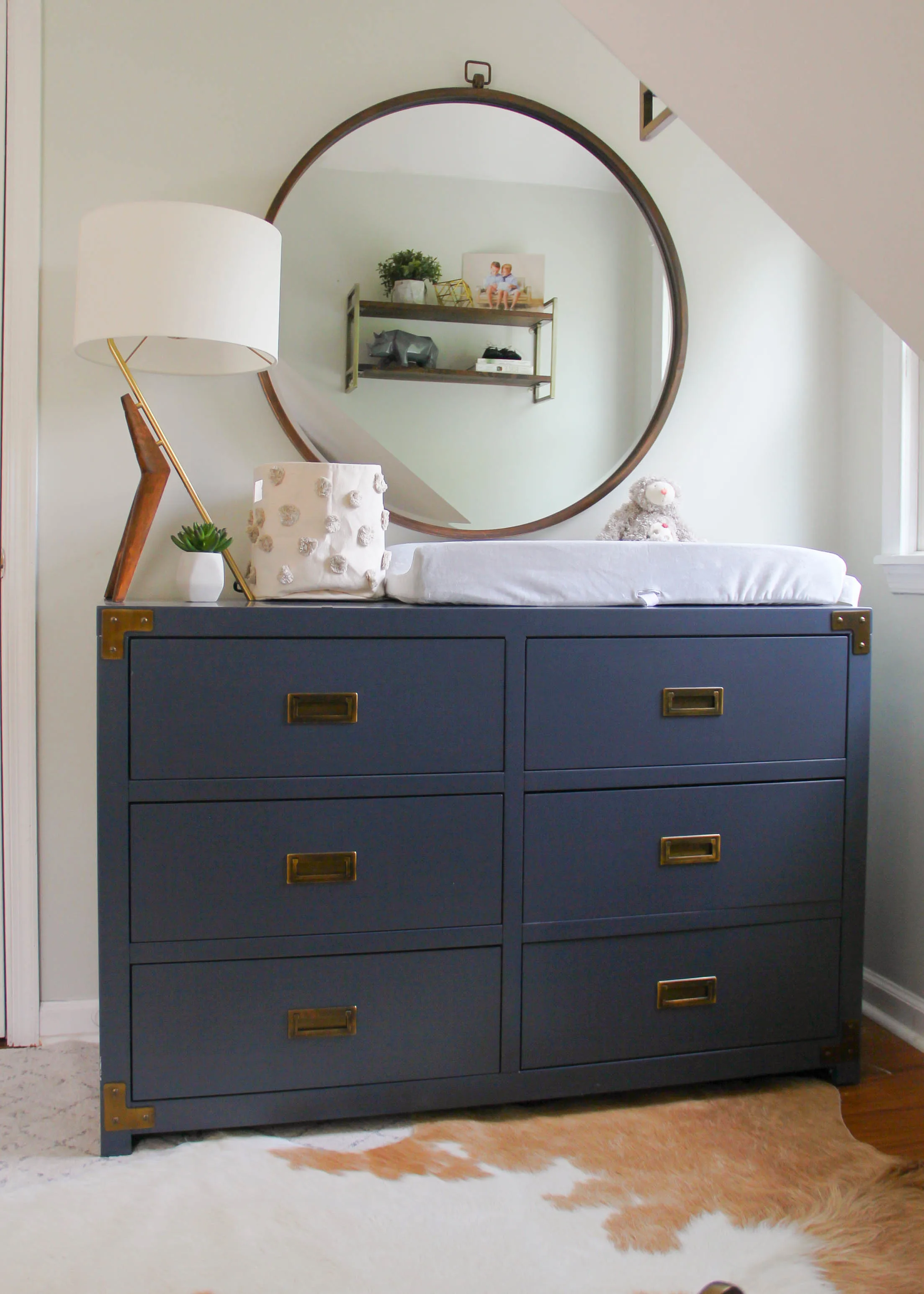 Eclectic Boy's Nursery with Navy Campaign Dresser
