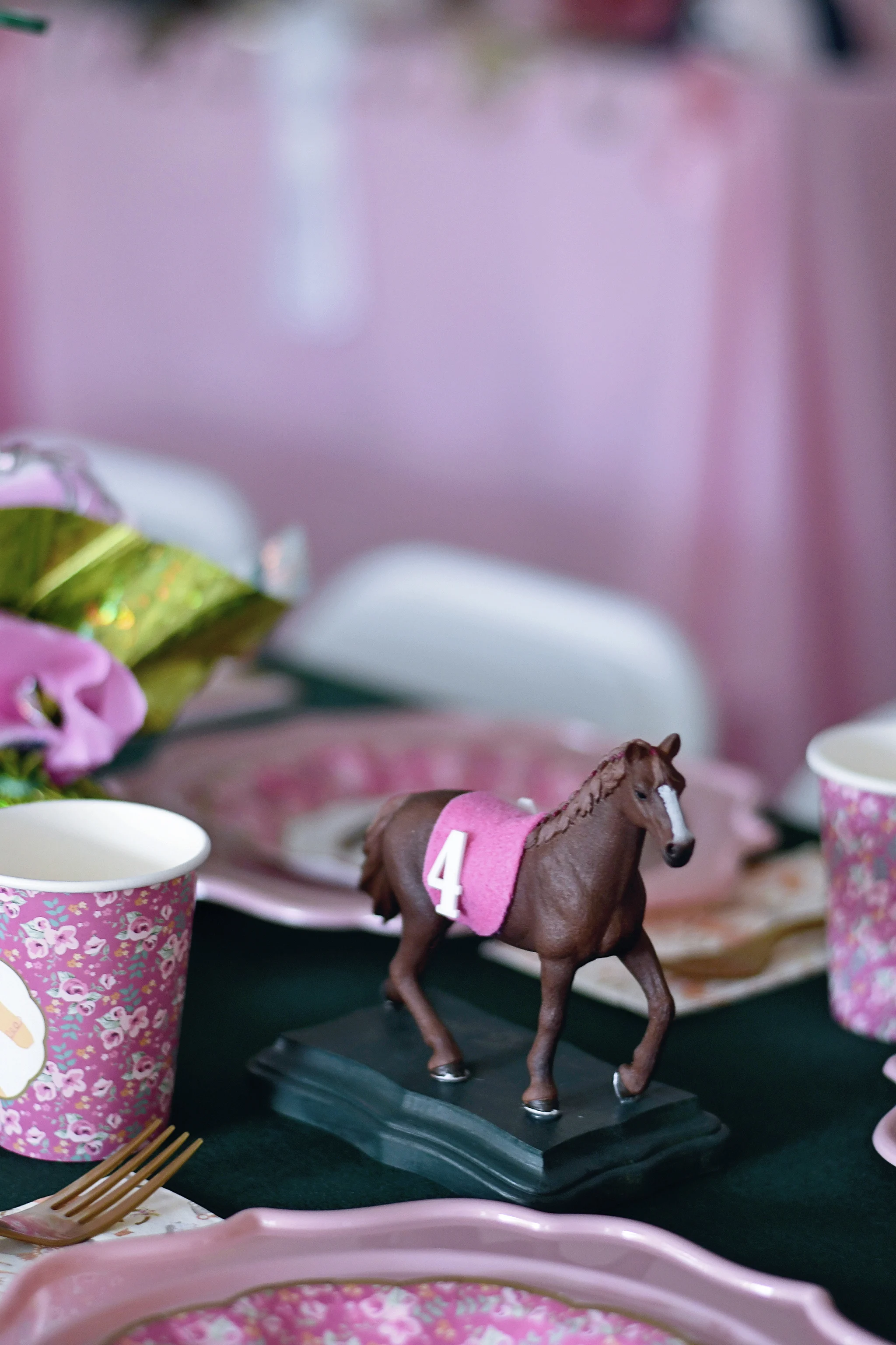 Handmade horse statues served as table centerpieces