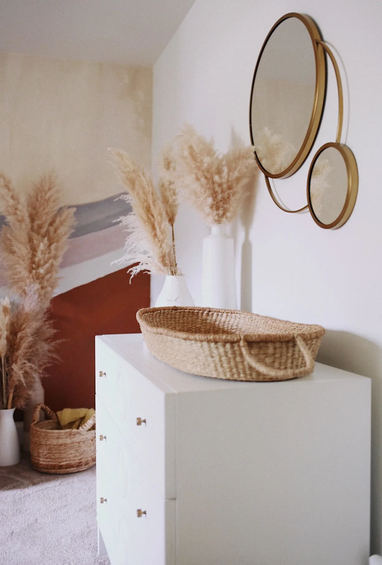 Changing Basket on Dresser with Brass Mirror and Pampas 