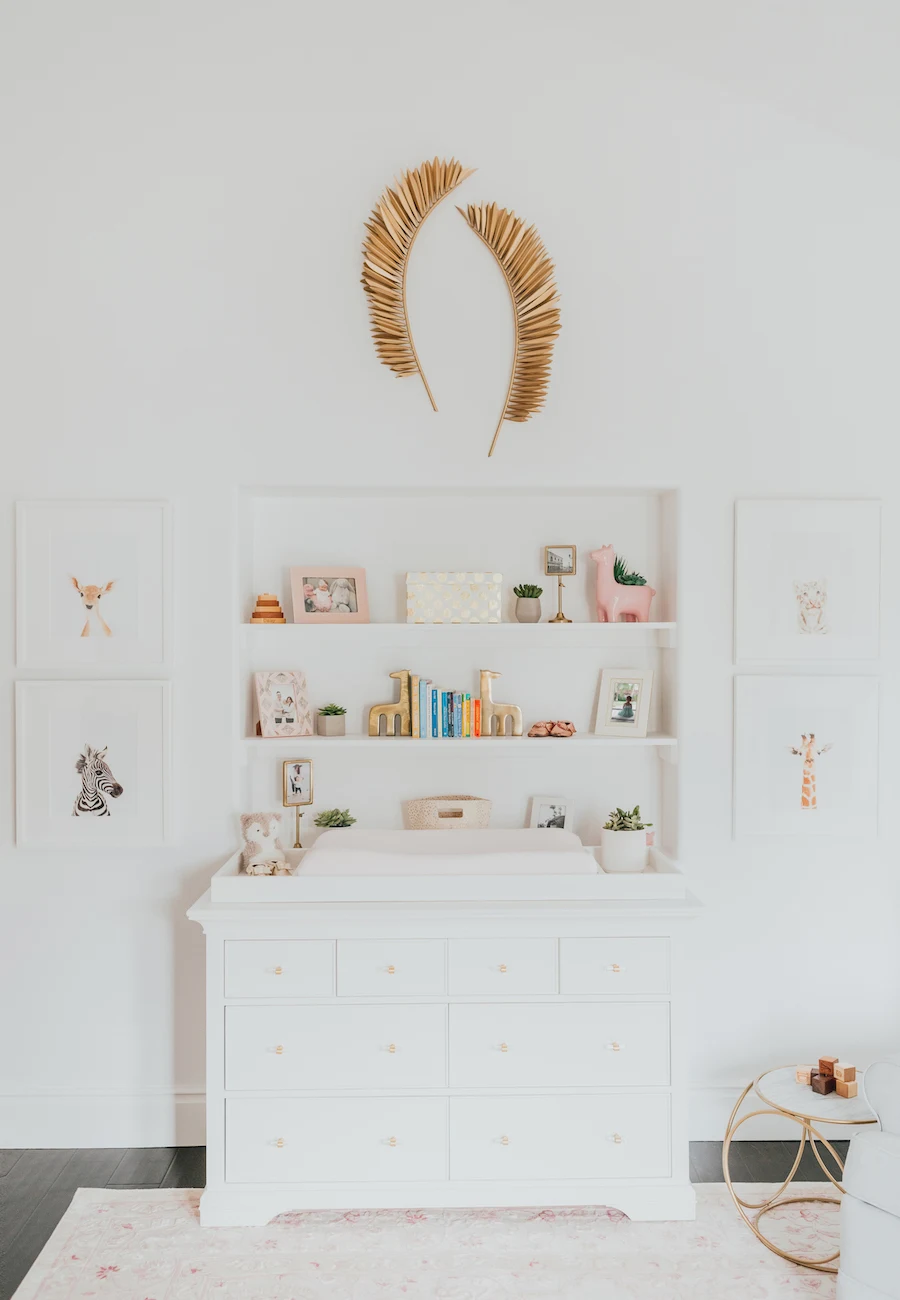 Pink Nature-Inspired Nursery with Wall Shelf Niche Above Changing Table/Dresser