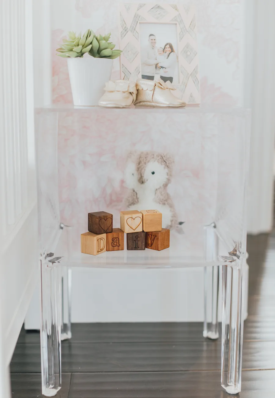 Acrylic Nursery Shelf Styling in Baby Girl Nursery