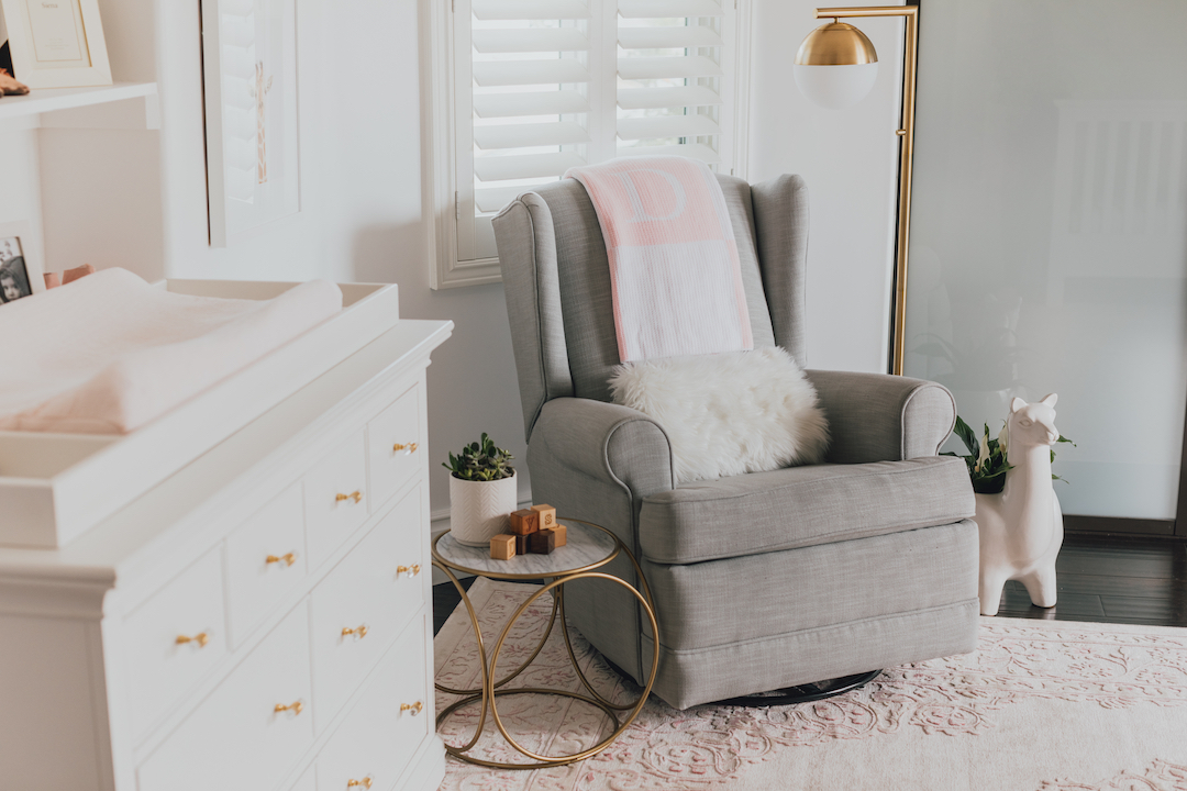 Pink Nature-Inspired Nursery with Gray Glider