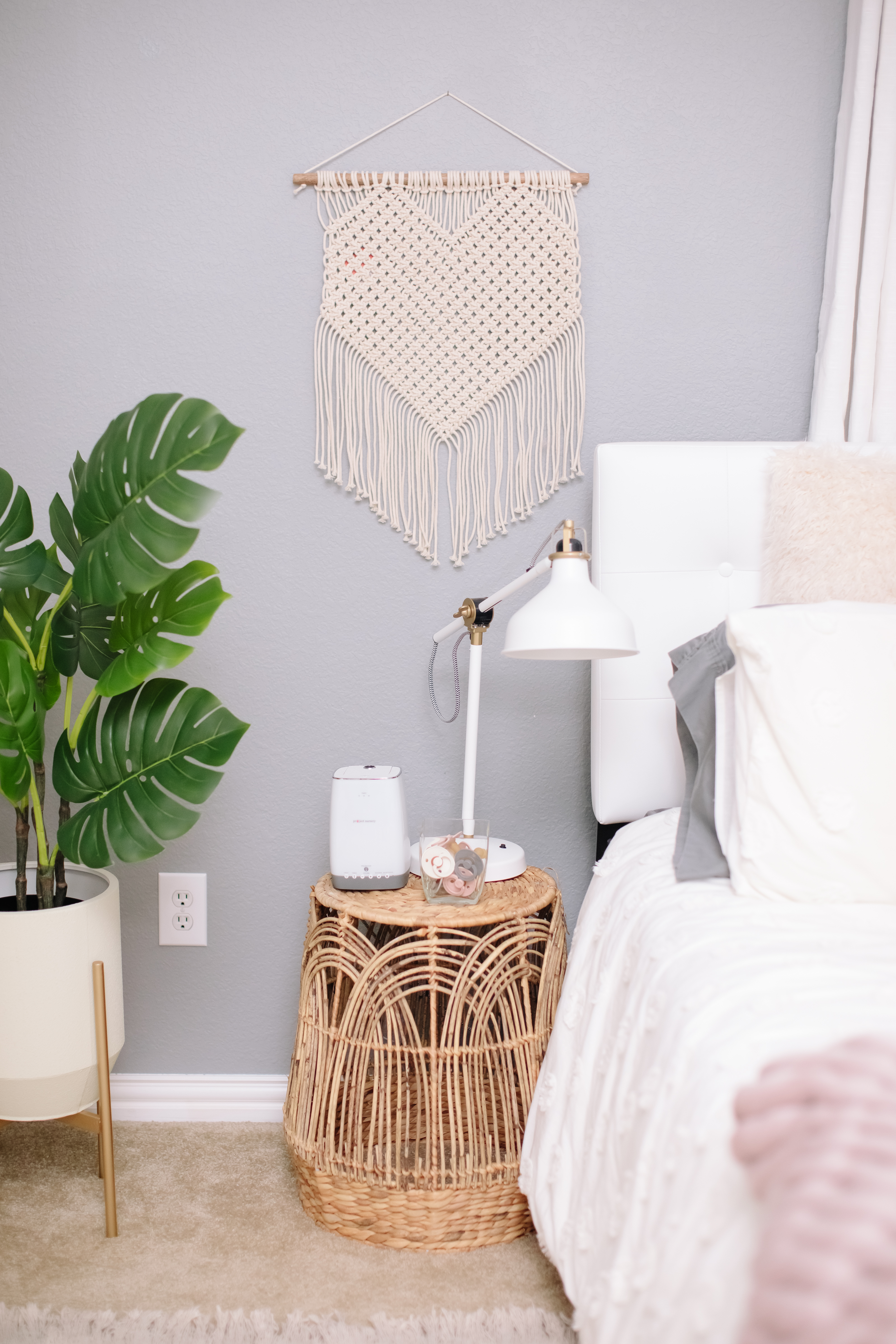 Macrame Wall Hanging and Rattan Side Table in Nursery Nook in Guest Room