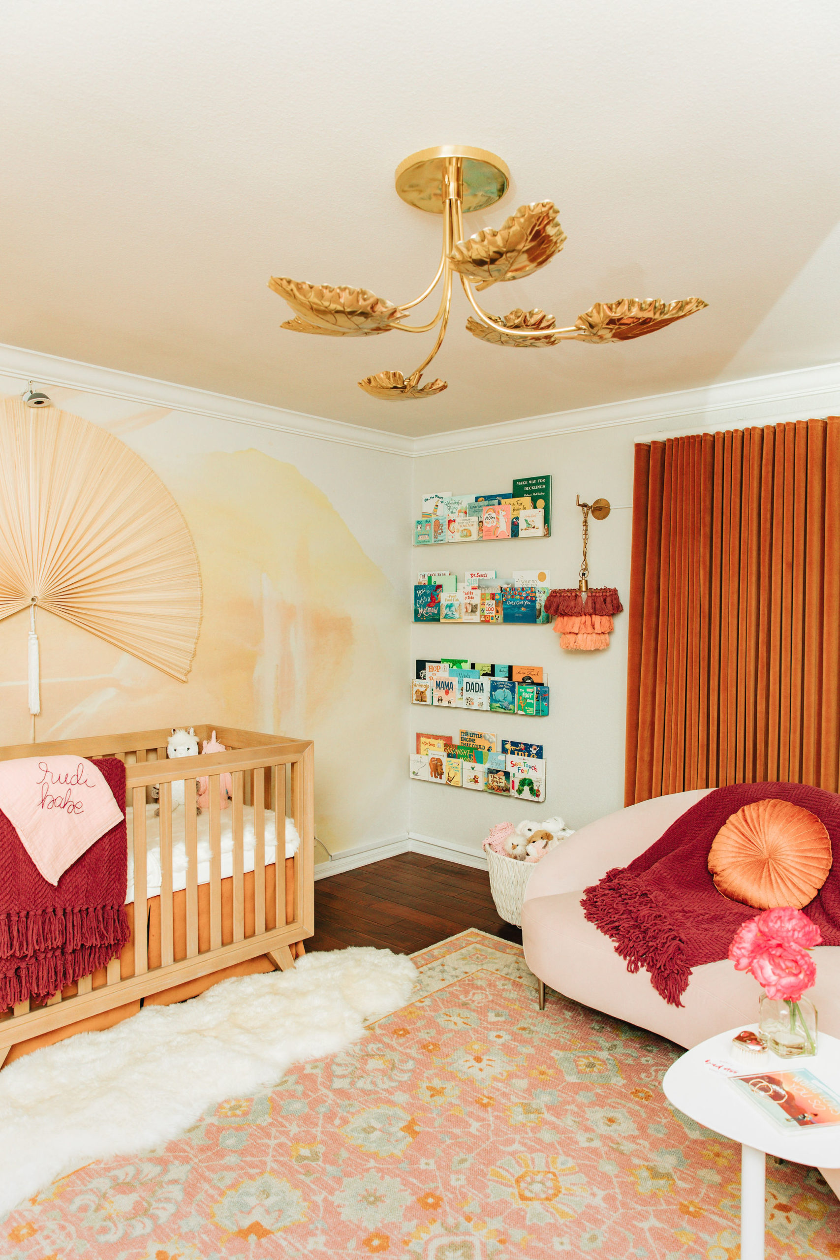 Unique Girls Nursery with Rusty Color Palette and Gold Leaf Light Fixture