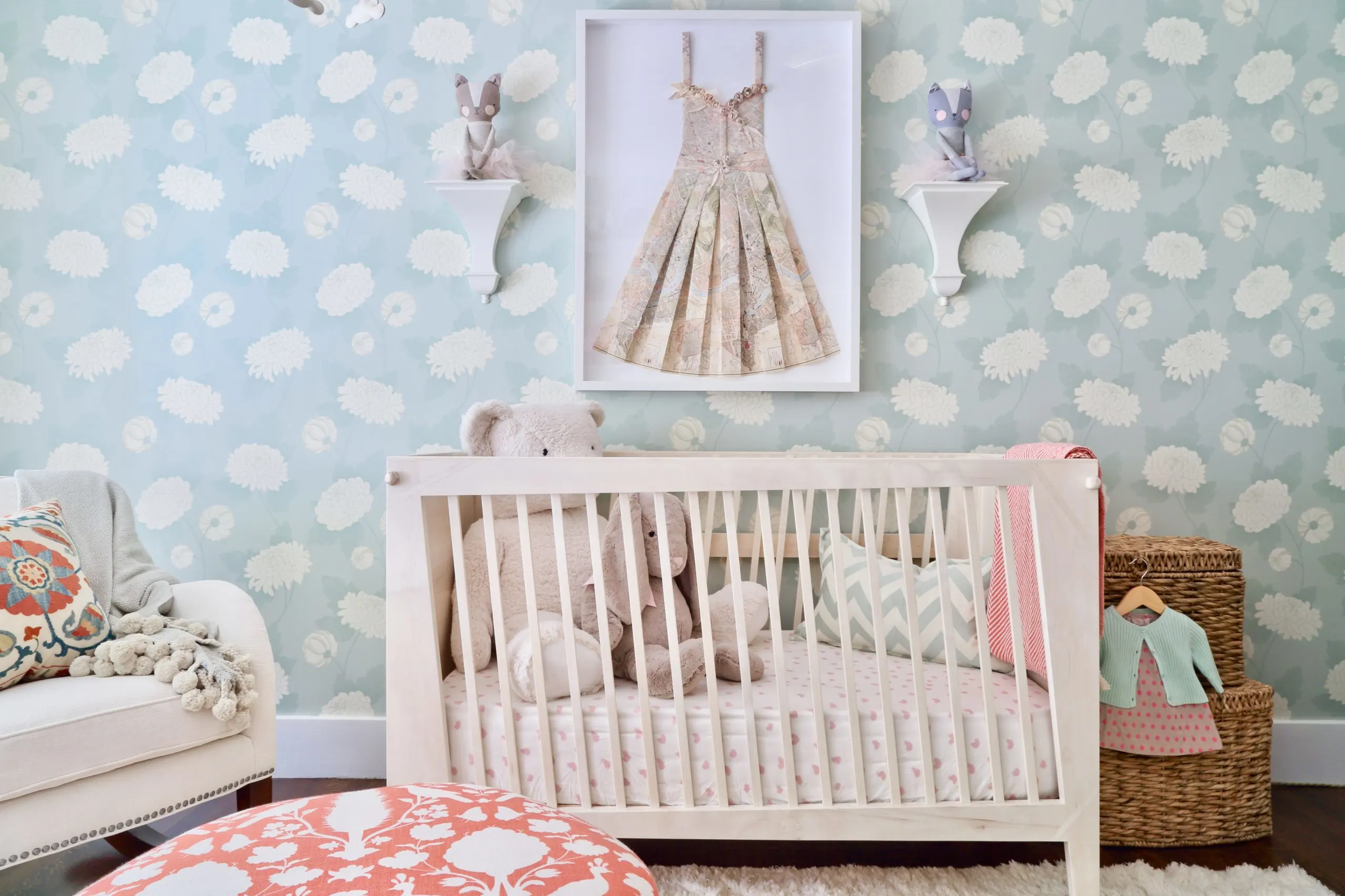 Whimsical Slanted Crib in Girl's Nursery with Folded Dress Art