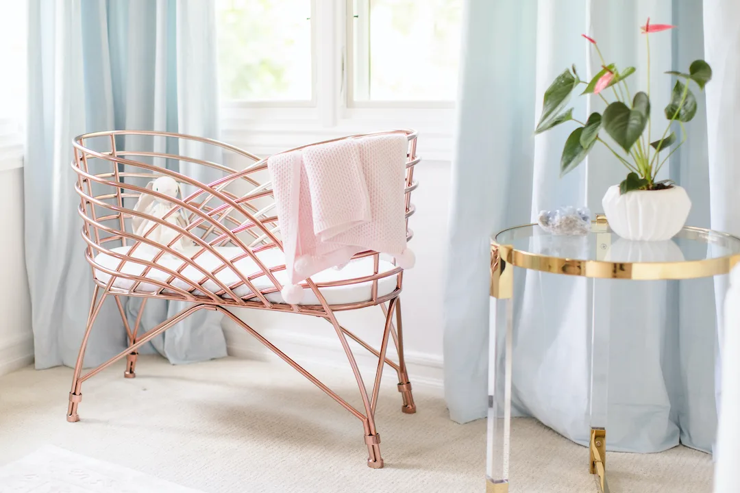 Rose Gold Bassinet in Pink & Blue Nursery by Little Crown Interiors