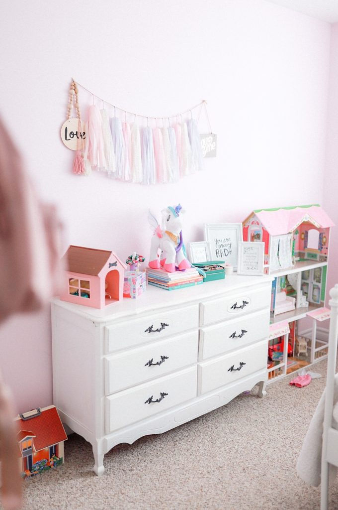 vintage dresser with a tassel garland