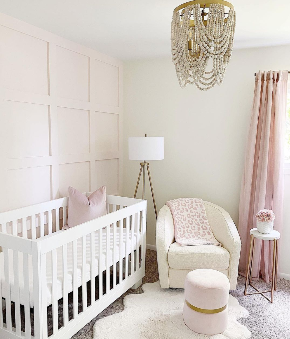 Pink Accent Wall and Boucle Swivel Glider in Nursery by @theblondewithabudget