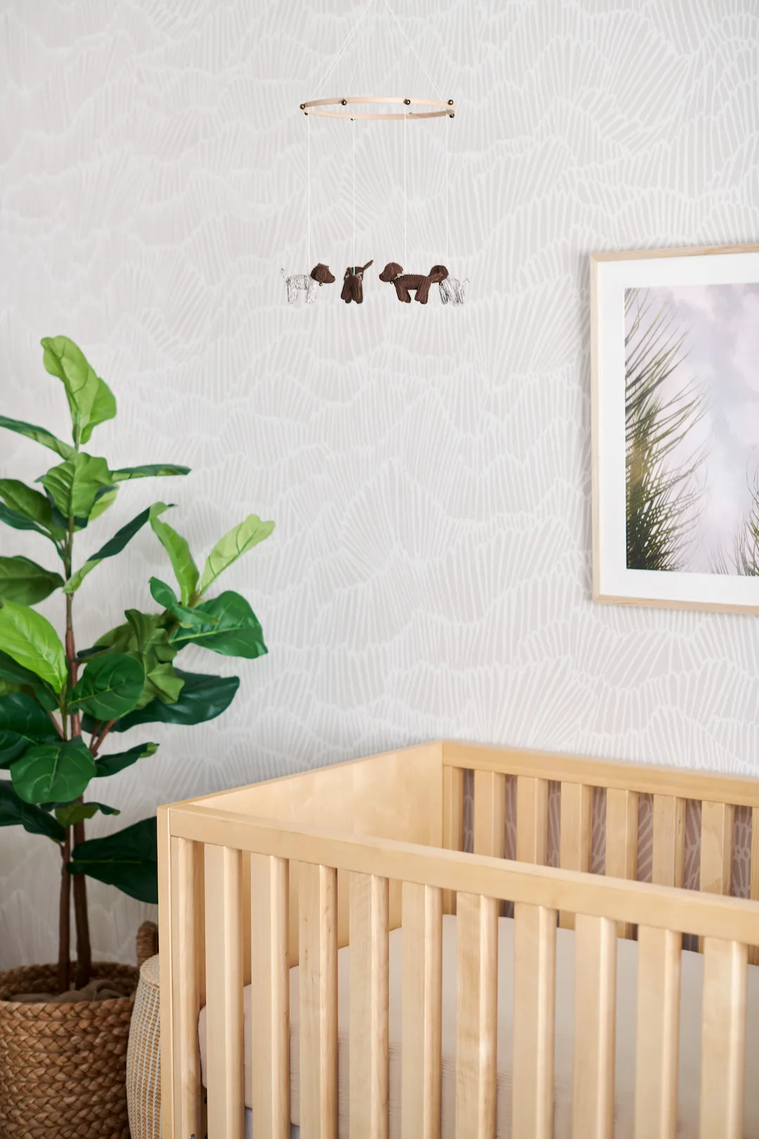 Neutral Wallpaper in Nursery with Dog Mobile