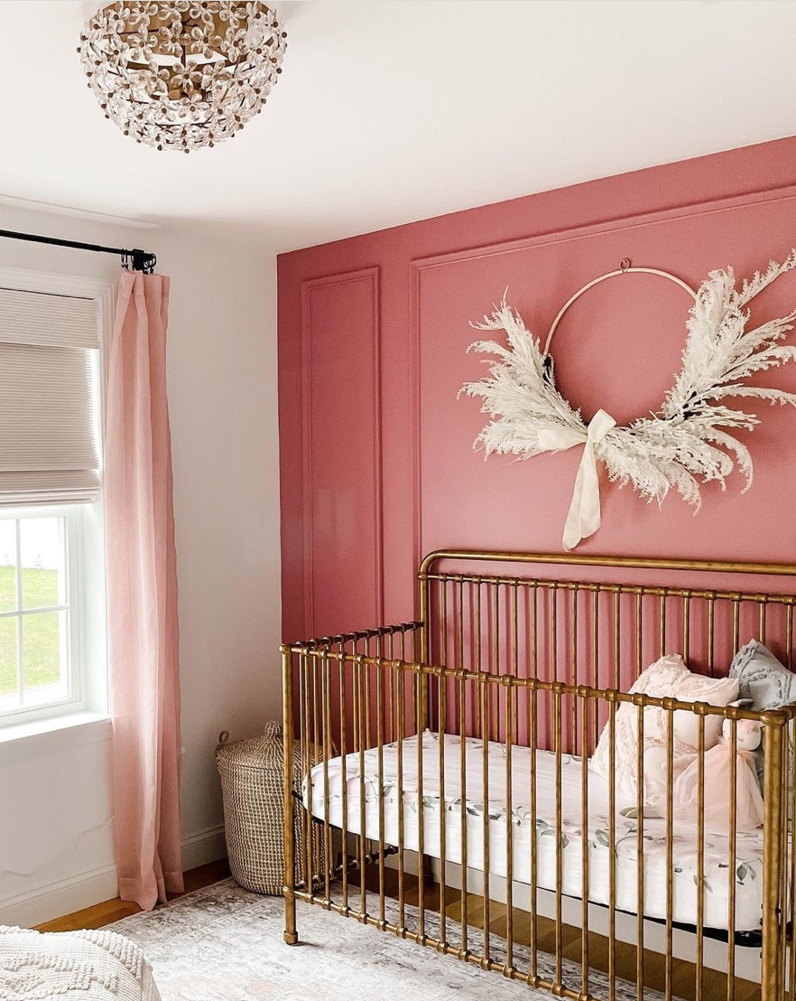 Dark Pink Accent Wall with Vintage Inspired Crib