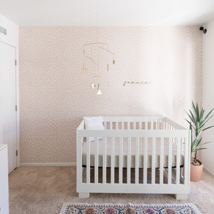 Modern Soft Boho Nursery featuring Pastel Pink Speckle Wallpaper