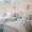 Shared Girls' Room with Coral Stenciled Accent Wall - Project Nursery