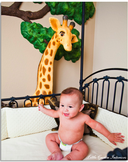 baby boy in a safari nursery with bratt decor crib